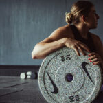 Nike Strength Athlete Gabriela Migala poses with a Grind Weight Plate