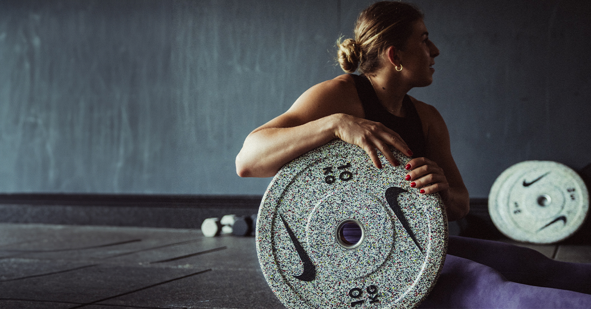 Nike Strength Athlete Gabriela Migala poses with a Grind Weight Plate